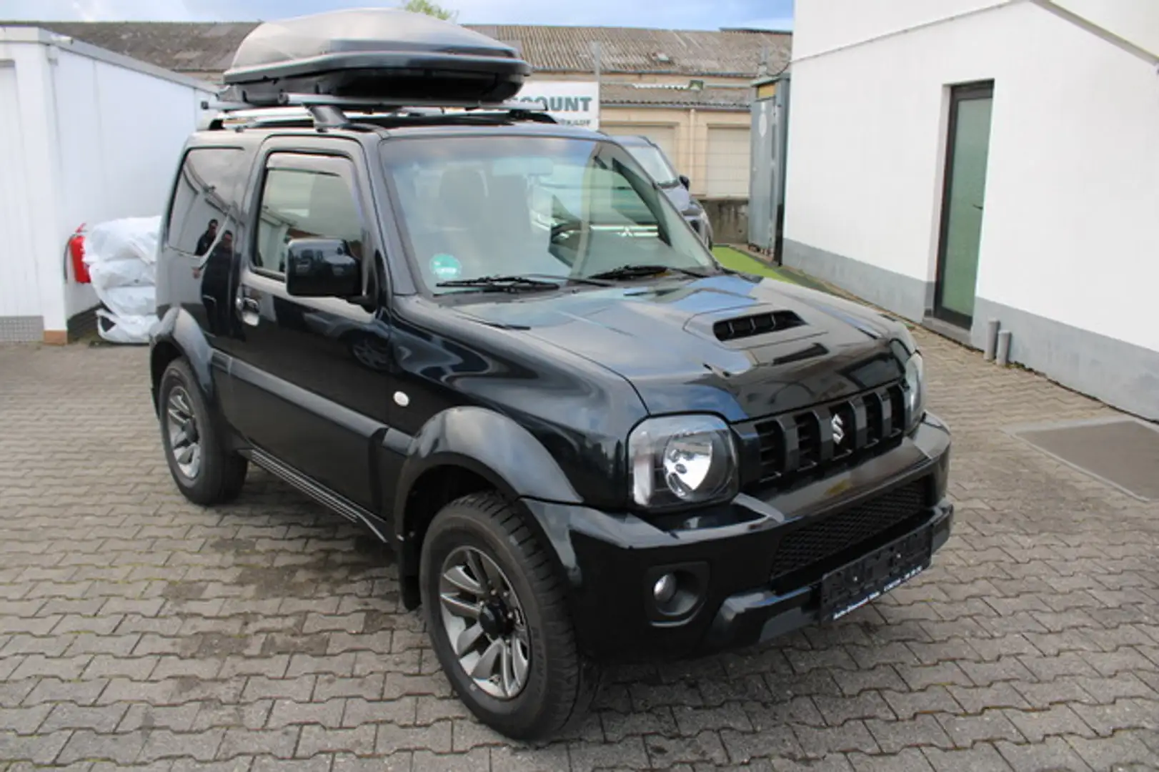 Suzuki Jimny Style Lim. *Dachbox*Leder*Sehr gepflegt* Negro - 1