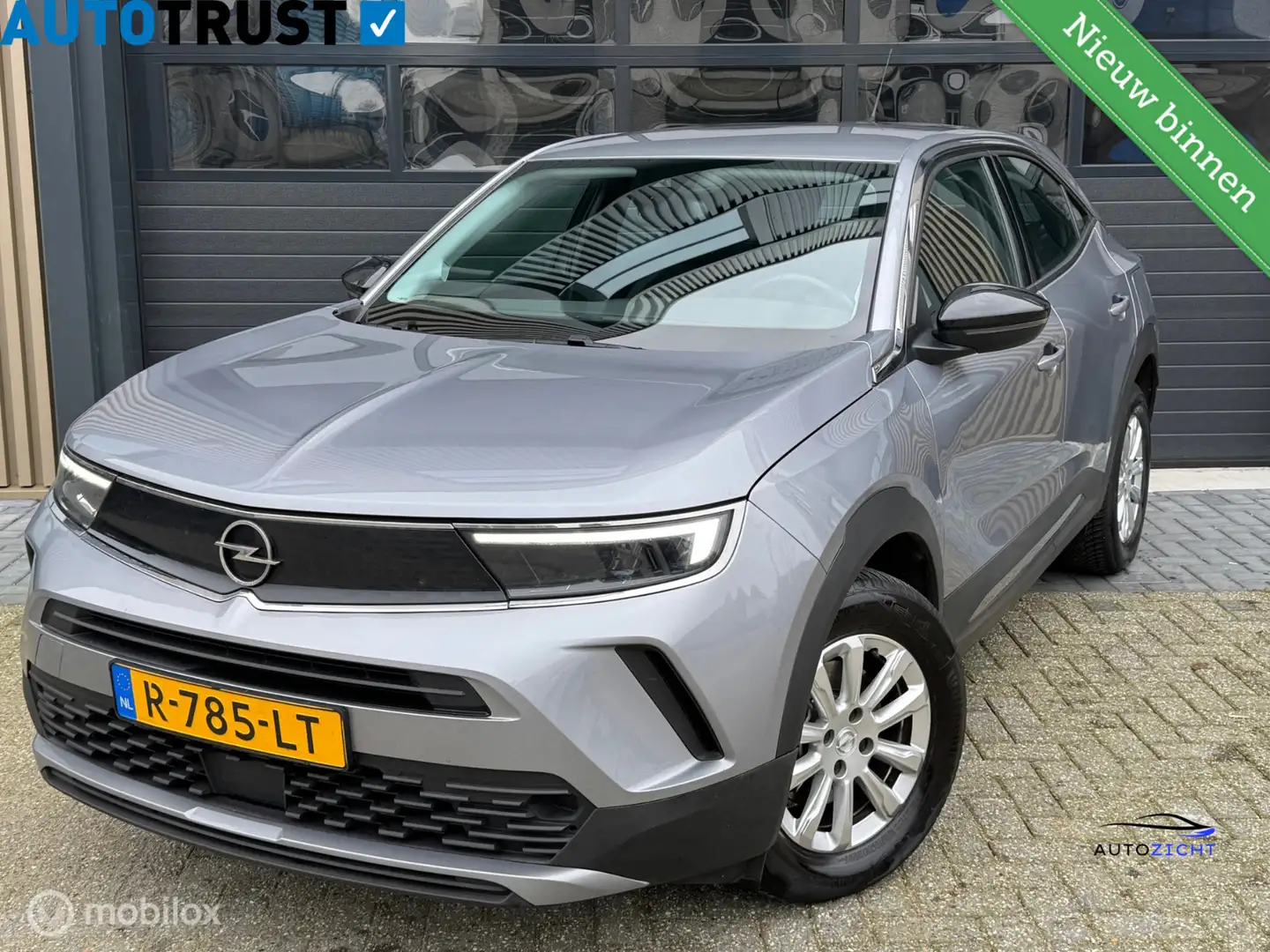 Opel Mokka-E Elegance 50-kWh 11kw bl. | Cruise | Camera | Carpl Grijs - 1