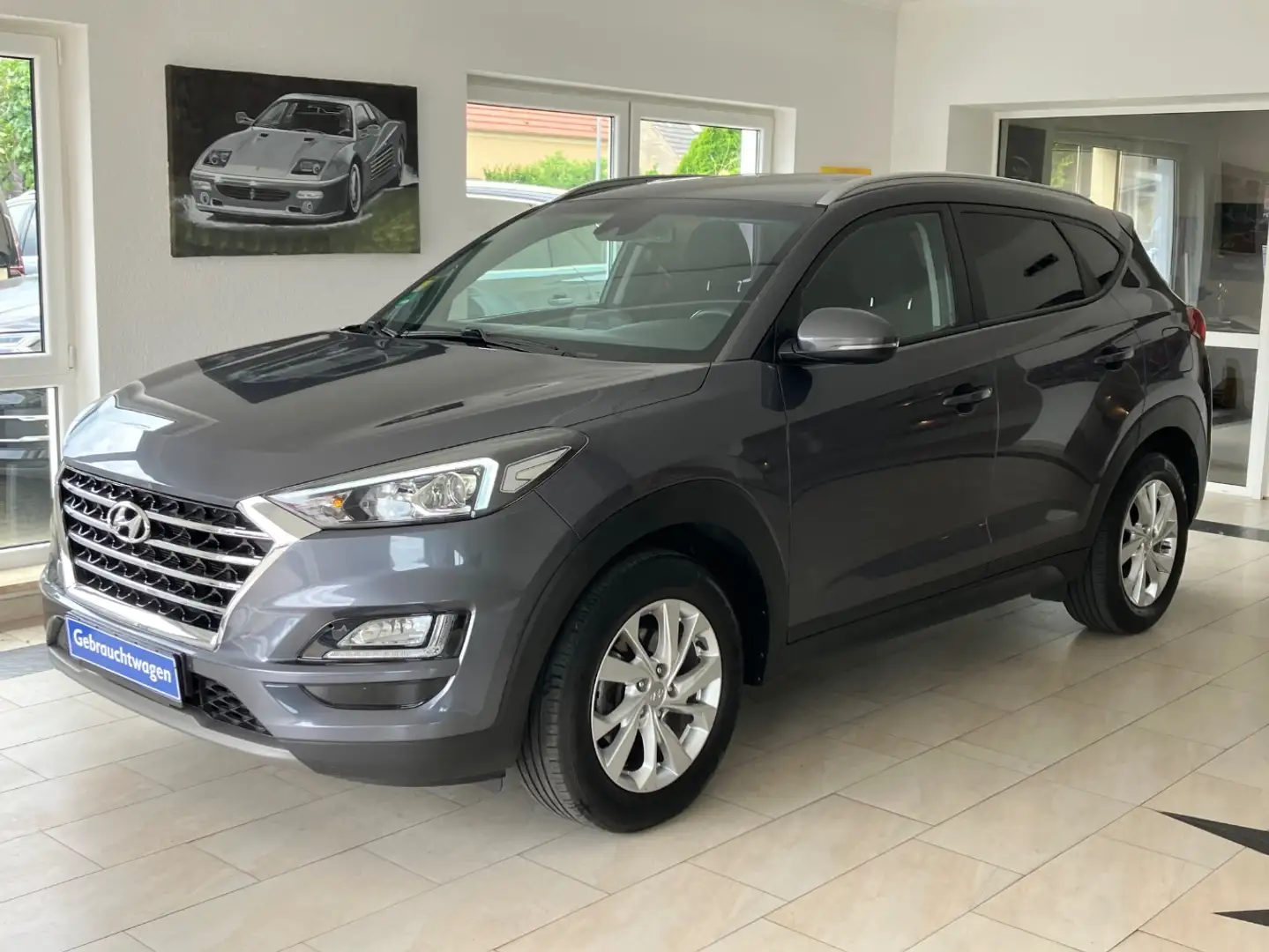 Hyundai TUCSON 1.6 T-GDI Trend 4WD 7DCT Assistenten Grijs - 1