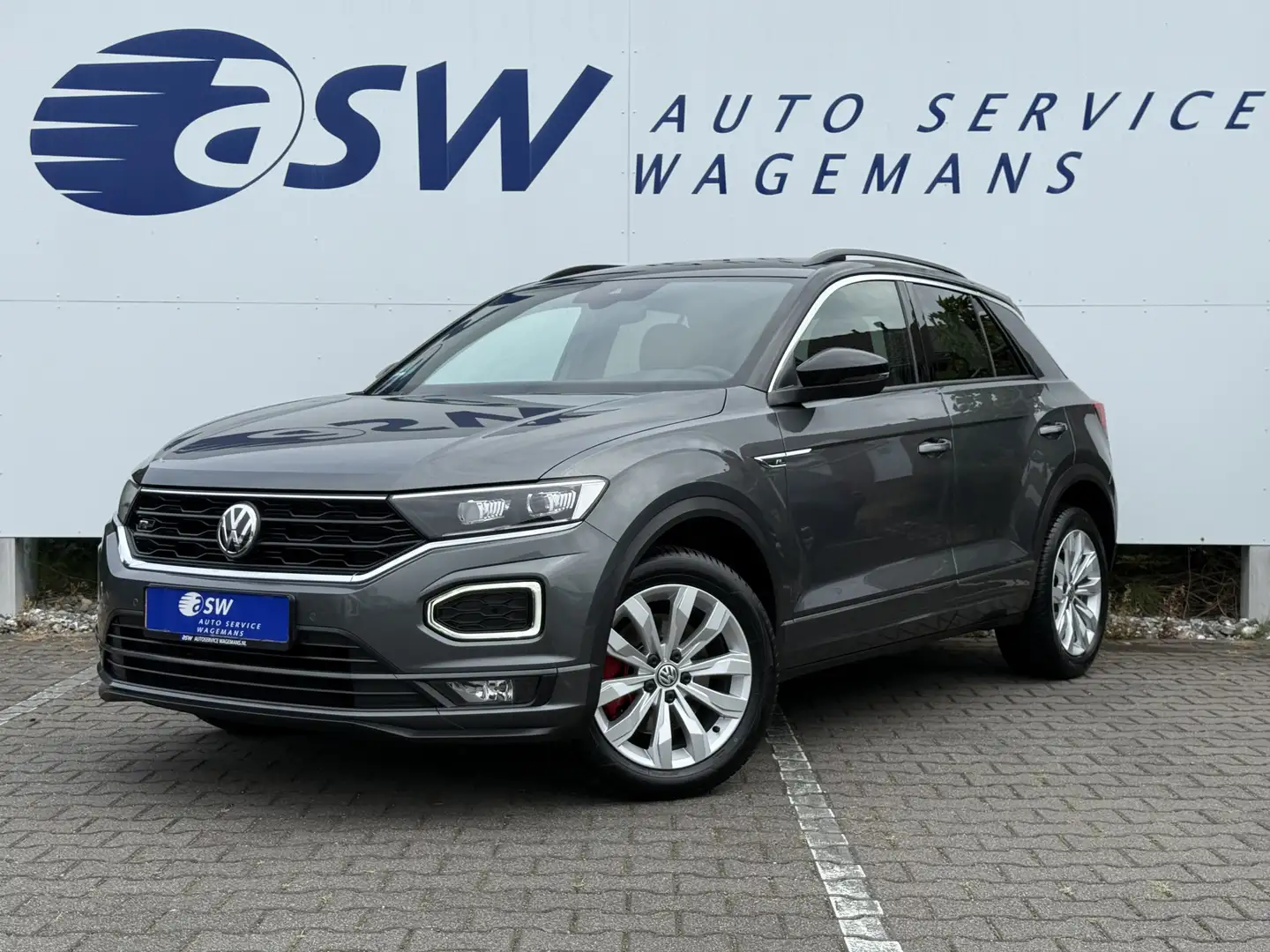 Volkswagen T-Roc 1.5 TSI Sport Business R | Navi | CarPlay | Camera Grijs - 1