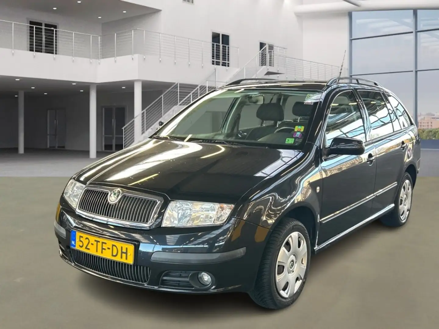 Skoda Fabia Combi 1.4-16V Spirit+/LAAG KM Zwart - 1