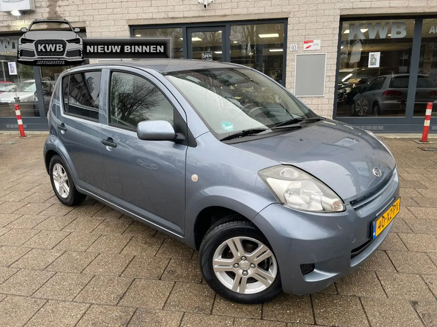 Daihatsu Sirion 2 1.0-12V Premium Airco Nieuwe apk NAP Gris - 1