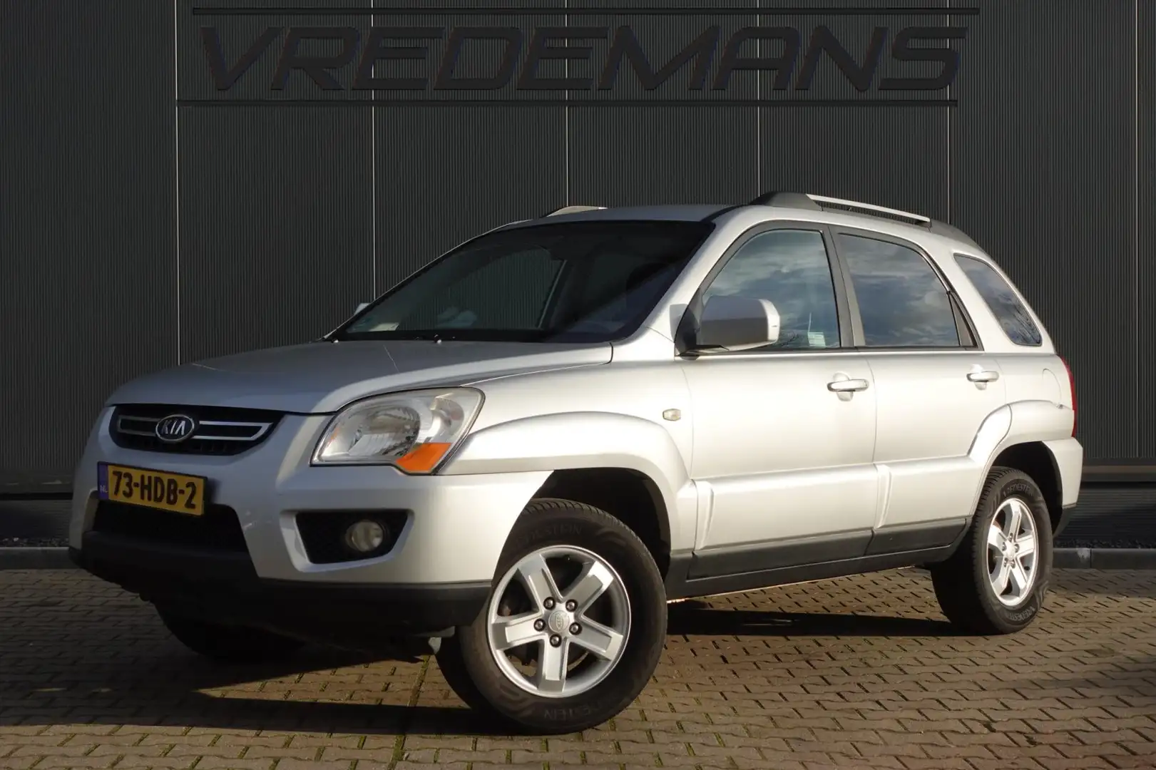 Kia Sportage 2.0 CVVT X-ecutive Grau - 1