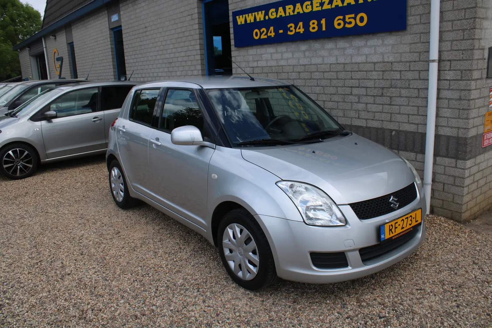 Suzuki Swift 1.3 5DR Comfort Airco Grijs - 1