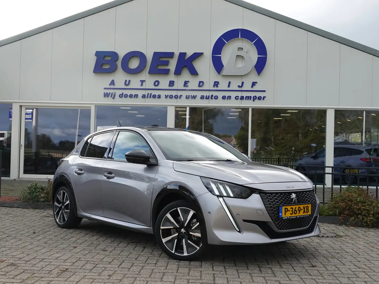 Peugeot e-208 EV GT Pack 50 kWh PANO | H-LEER | KEYLESS | GR. NA Gris - 1