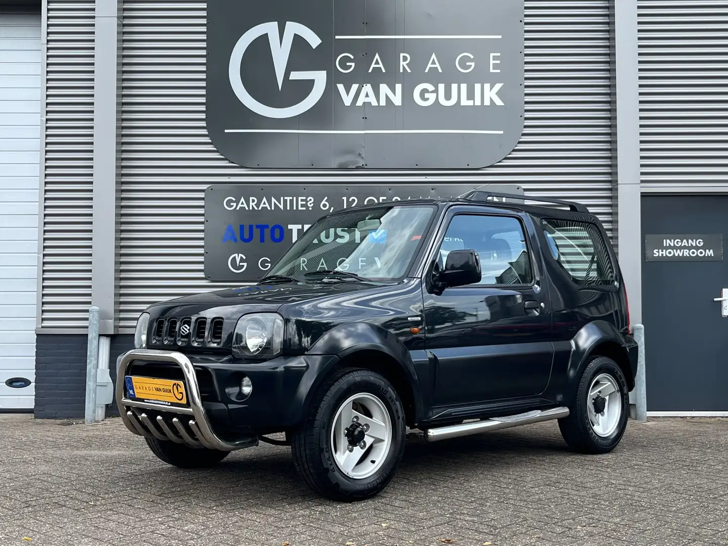 Suzuki Jimny 1.3 Special 80PK Trekhaak,4WD,ElektrRamen,Bull-Bar Schwarz - 1