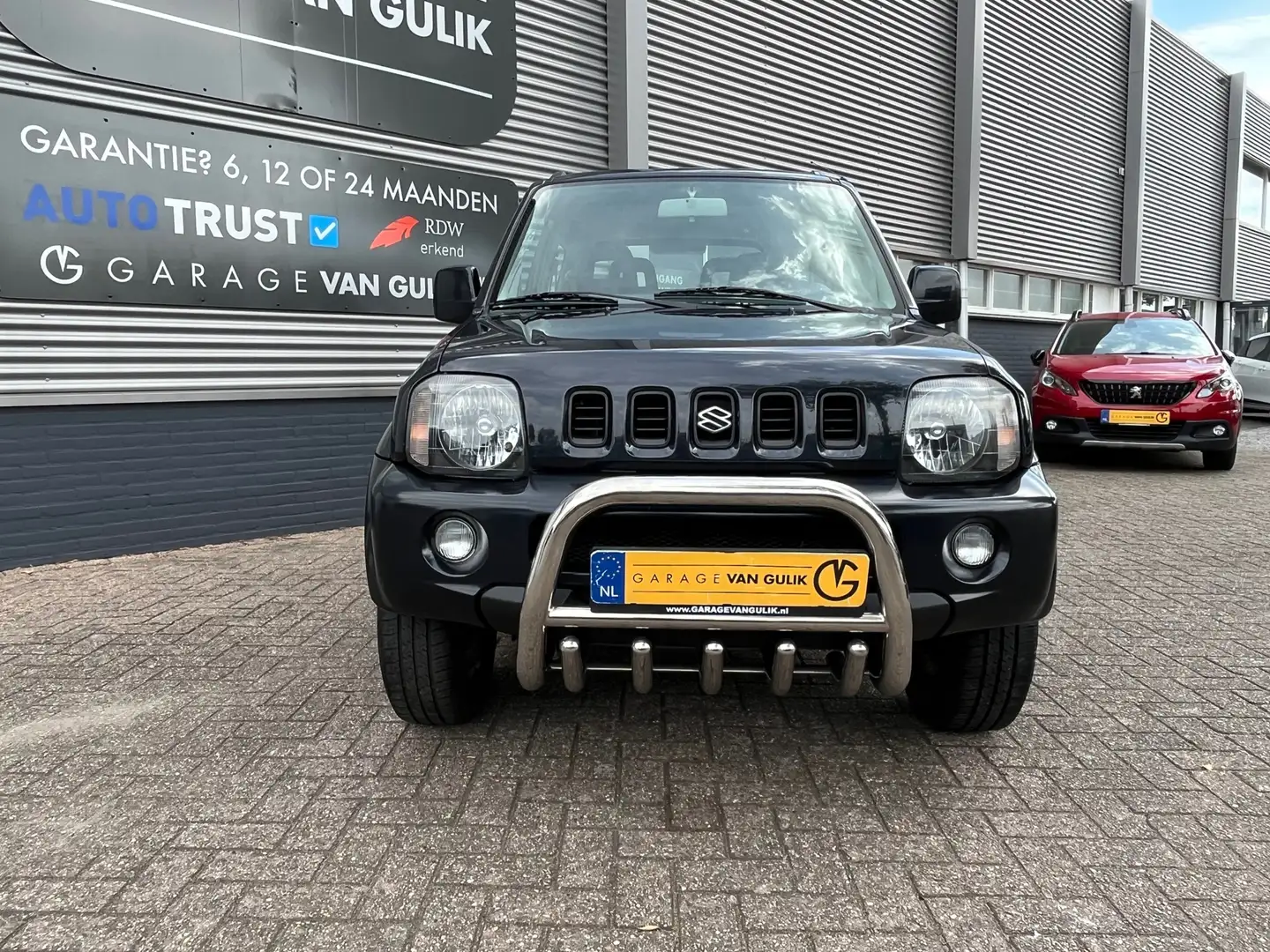 Suzuki Jimny 1.3 Special 80PK Trekhaak,4WD,ElektrRamen,Bull-Bar Schwarz - 2