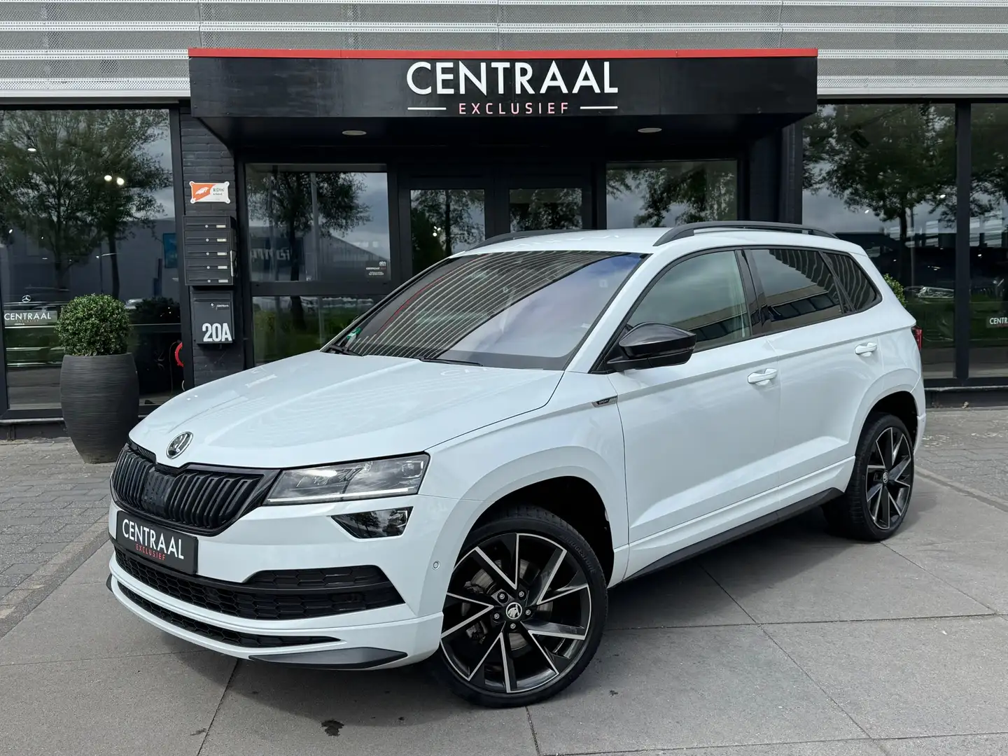 Skoda Karoq 1.5 TSI ACT Sportline 150PK|Canton|Camera|ACC|Keyl Wit - 1