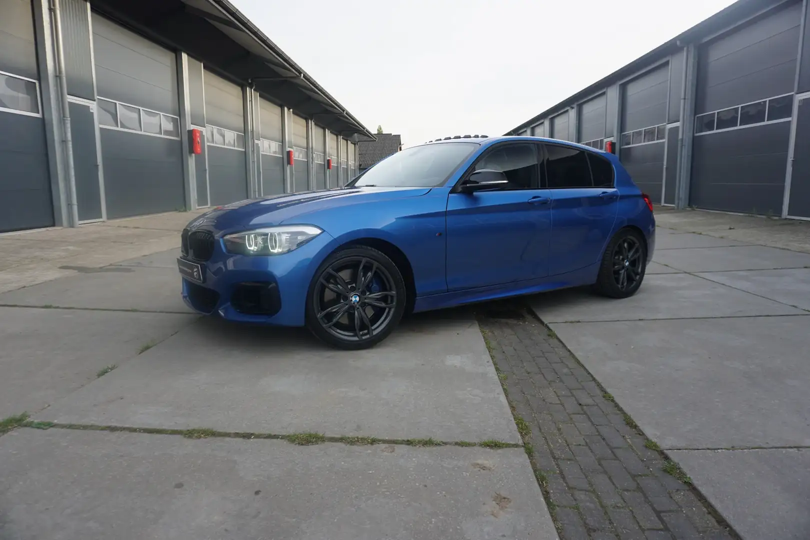 BMW 140 BMW 1-serie M140i Executive Panorama NIEUWSTAAT Blauw - 1