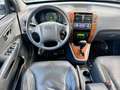 Hyundai TUCSON 2.7i V6 4WD Style AUT LEER DAK CLIMA LMV PDC NAP A Grau - thumbnail 2