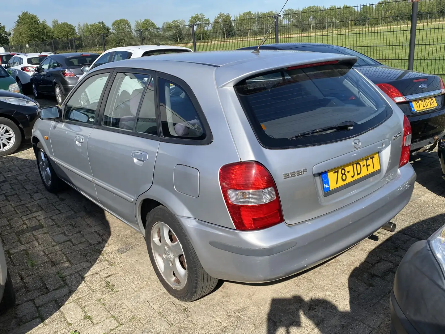 Mazda 323 Fastbreak 1.6i Touring, AIRCO, 150.455 KM NAP, 2E Grijs - 2