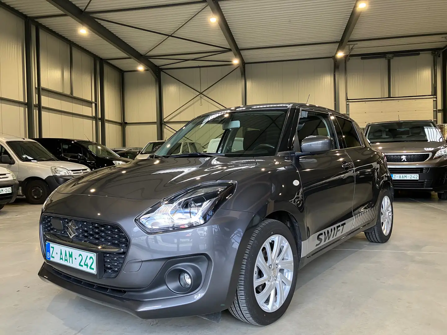 Suzuki Swift 1,2 HYBRID FULL OPTION 1 Eig omniumgarantie Gris - 1
