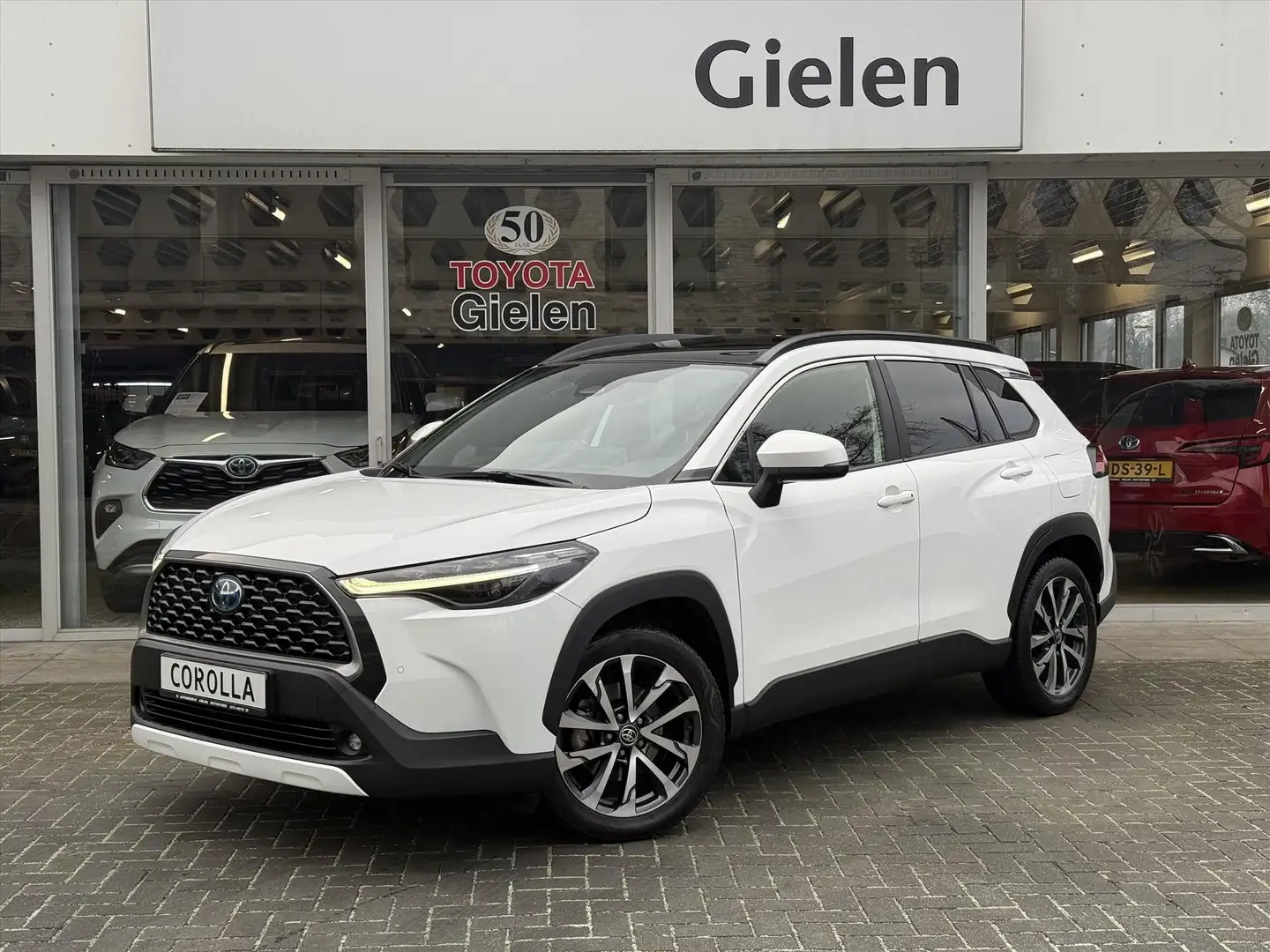 Toyota Corolla Cross 2.0 Hybrid AWD Style | Trekhaak, Panoramadak, Dode Blanc - 1