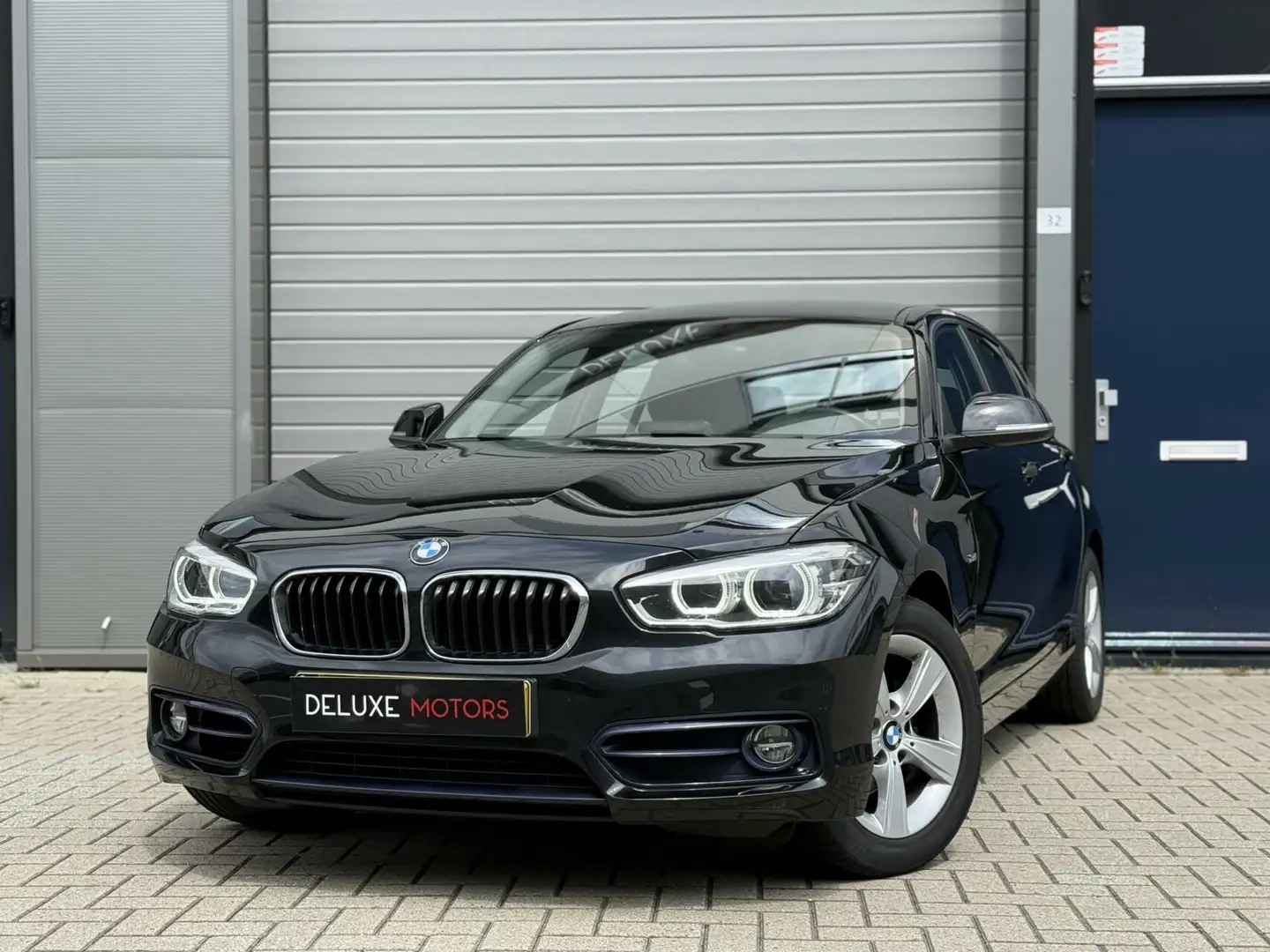 BMW 118 1-serie 118i Executive NL auto - NAP Zwart - 1