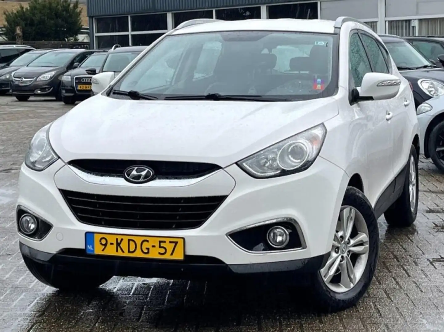 Hyundai iX35 1.6i GDI ACTIVE NAVI/LEER/PDC/CLIMATE Wit - 1