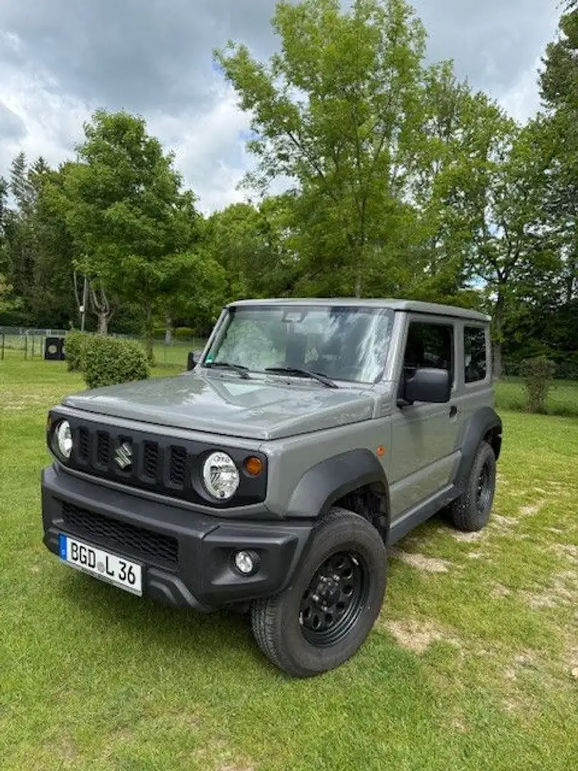 Suzuki Jimny Comfort + AllGrip, 8-fach, neuw. Zust.,NFZ Gris - 1