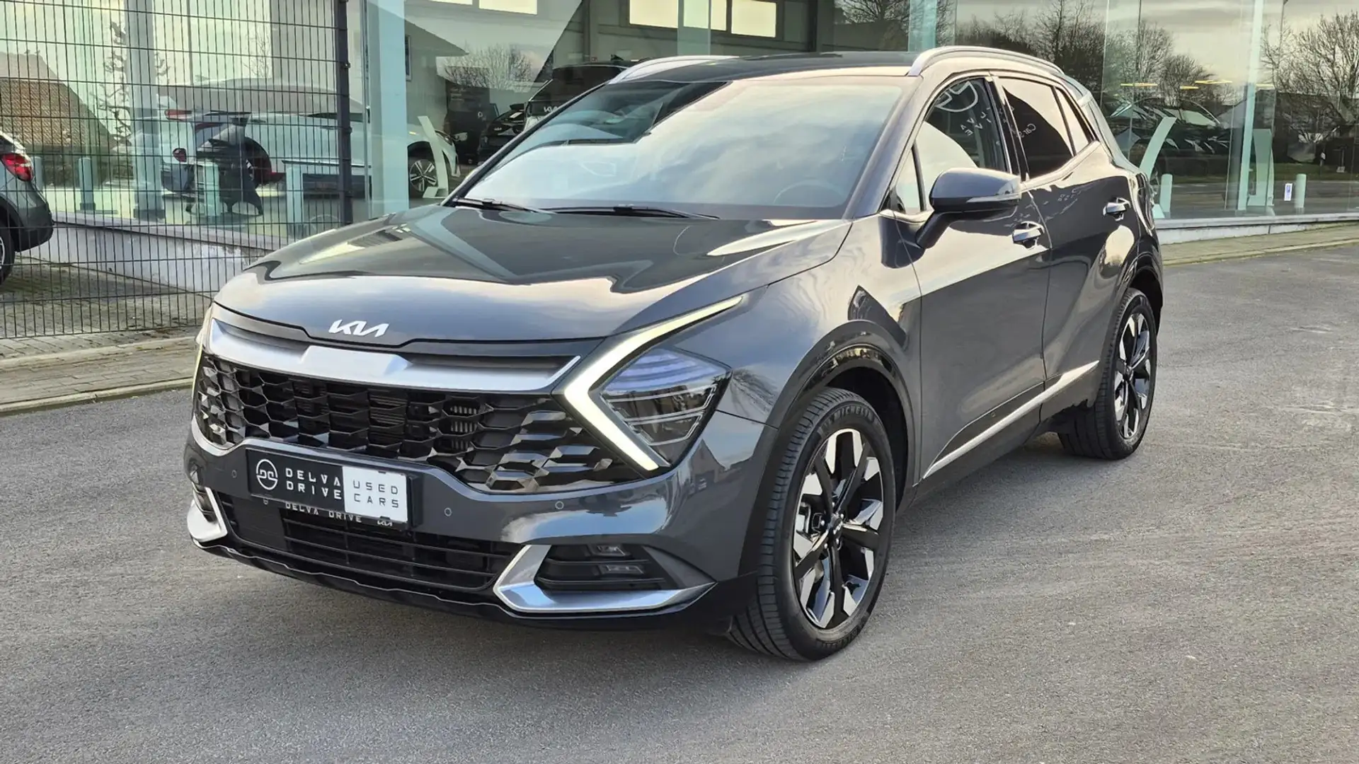 Kia Sportage 1.6 T-GDi PACE PHEV AWD ✅ Plug-in Hybrid Grijs - 1