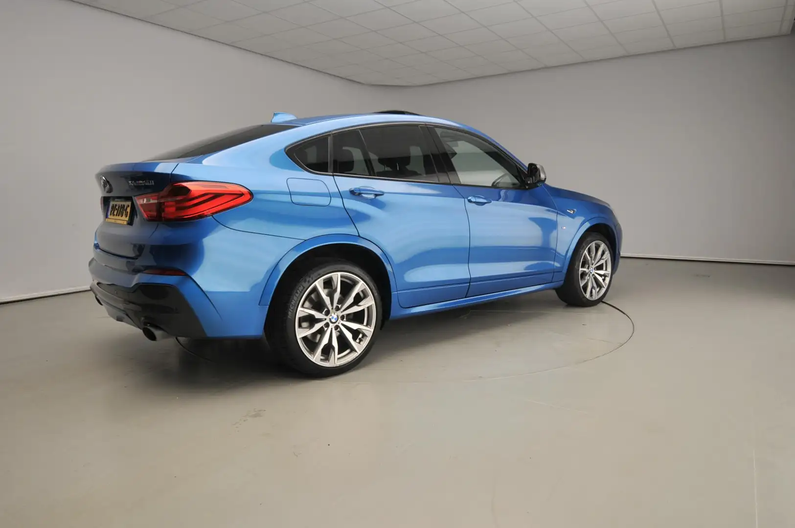 BMW X4 M40i | M-Sportpakket | LED | Leder | HUD | Active Blau - 2