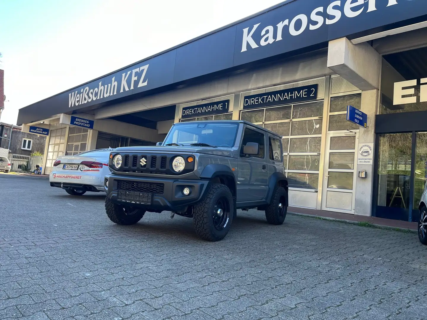 Suzuki Jimny Comfort AllGrip super Zustand und Super OPTIK!!AHK Grau - 1