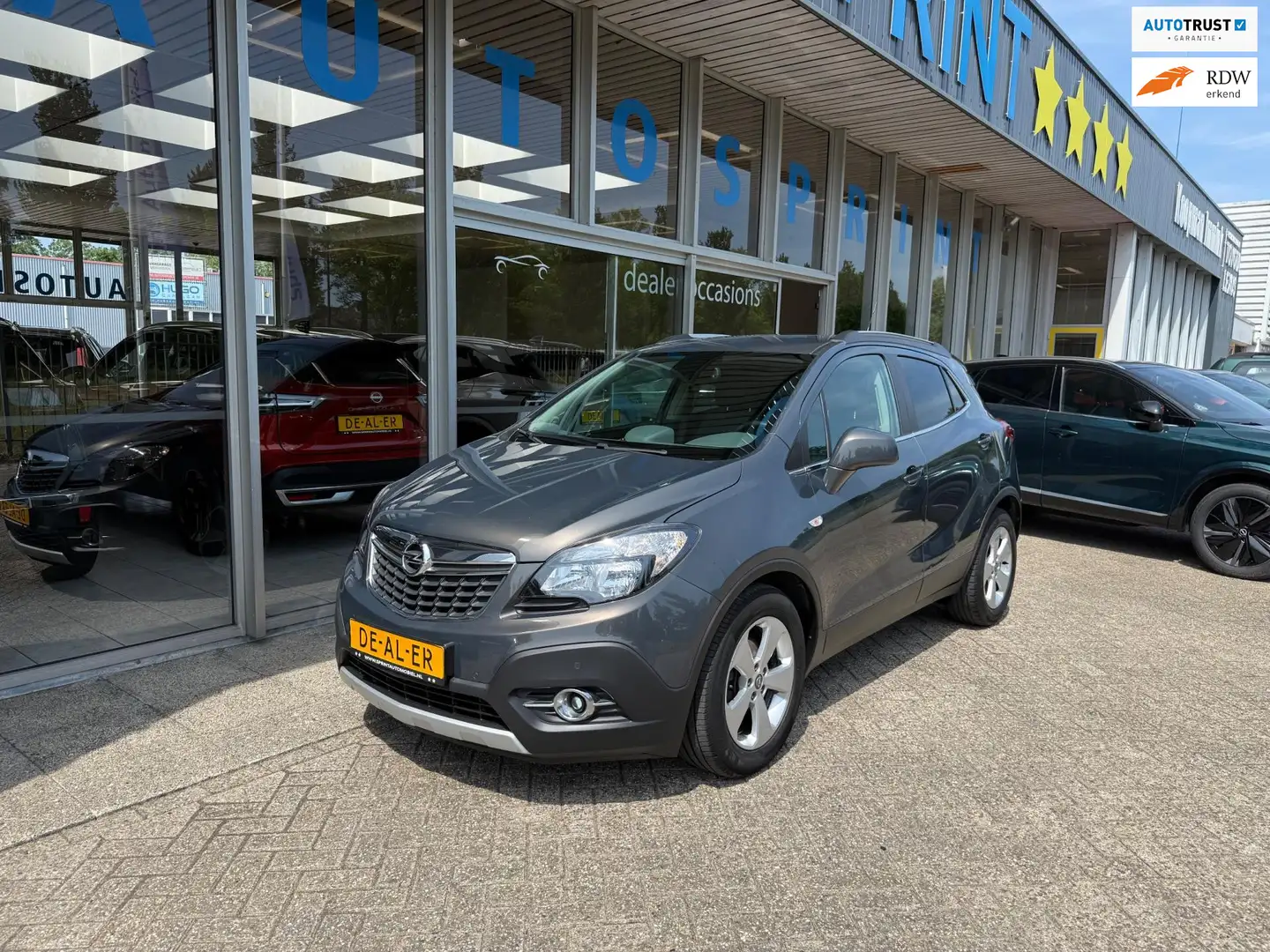 Opel Mokka 1.4 T Cosmo 140PK / NAVIGATIE / ACHTERUITRIJCAMERA Grijs - 1