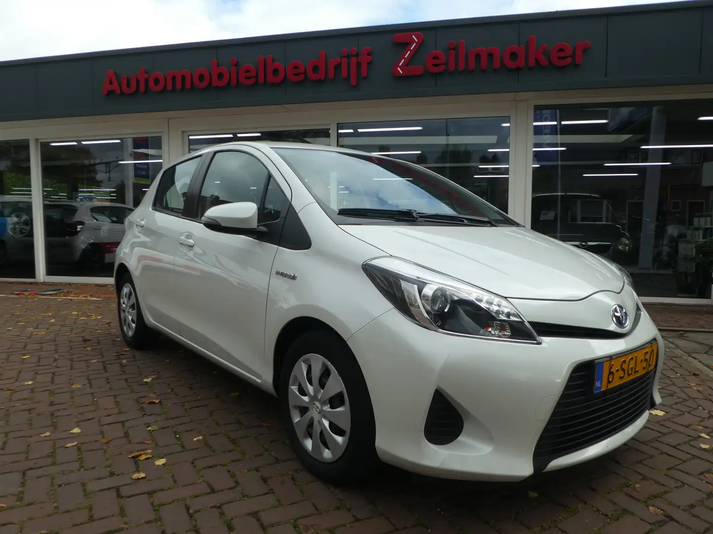 Toyota Yaris 1.5 Full Hybrid Aspiration Clima, Navi, Camera, Af Wit - 1