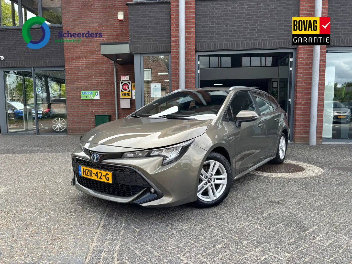 Toyota Corolla Touring Sports 1.8 Hybrid Active,Navi,PDC,1 jaar g Vert - 1