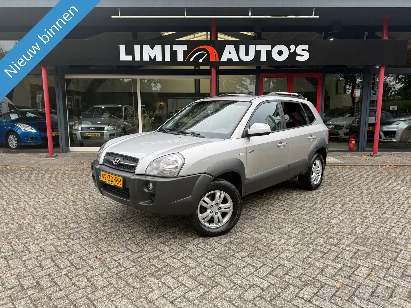 Hyundai TUCSON 2.7i V6 4WD Style/Aut/Climate/Cruise/Pdc/Leer/Open Grau - 1