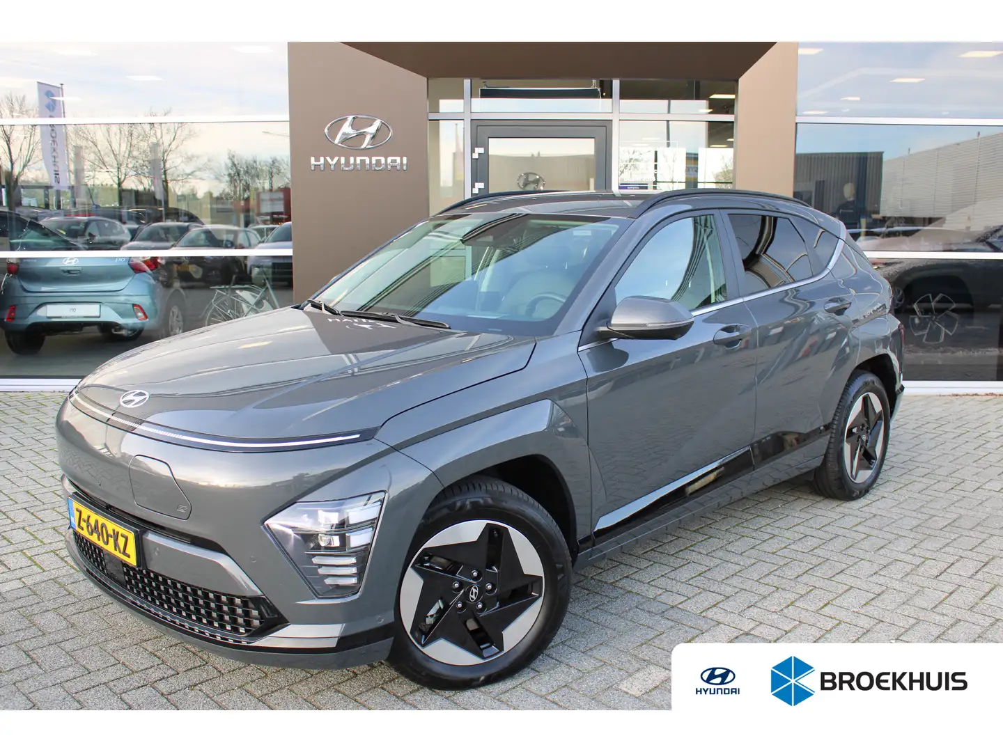 Hyundai KONA Electric Premium 65.4 kWh + 17 INCH | Leder | 360 Gris - 1
