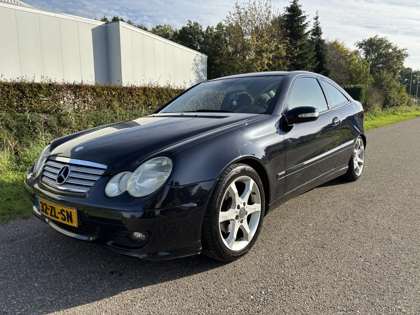 Mercedes-Benz C 180 Sportcoupé K. / SPORT EDITION / NAVI / CRUISE / AI Zwart - 1