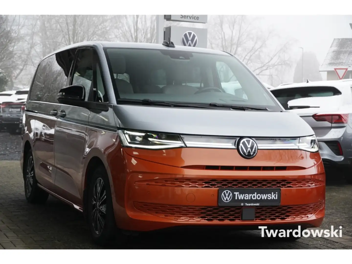 Volkswagen T7 Multivan eHybrid lang DCC StHz Kam ACC Pano Orange - 1