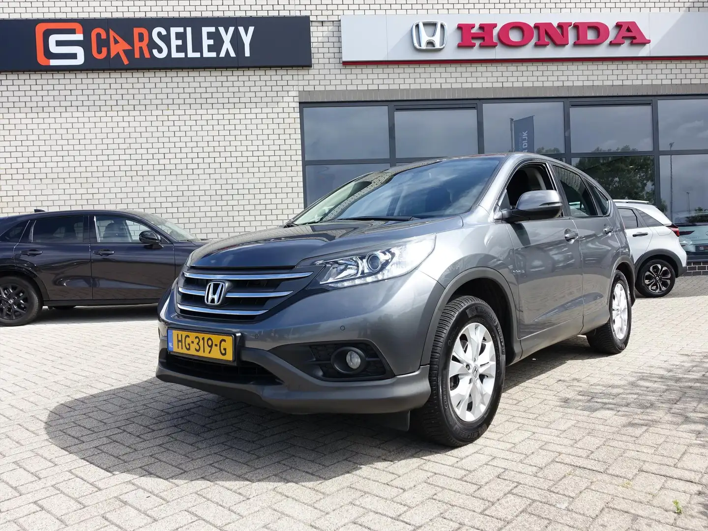 Honda CR-V 2.0 16V 155pk Real Time 4WD Aut. Elegance Grijs - 1
