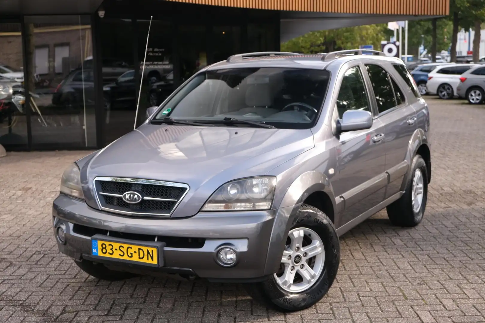 Kia Sorento 2.4i X-treme/4x4/Clima/Trekhaak/Cruise/Verwarmde v Grigio - 1