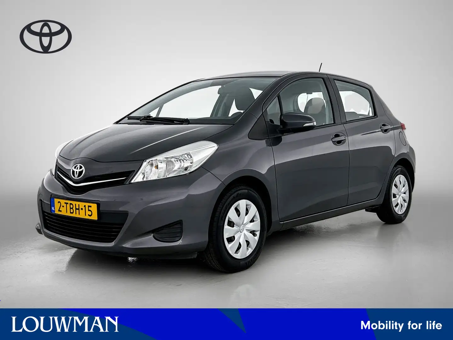 Toyota Yaris 1.0 VVT-i Now | Airco | CD | Trekhaak | 1-8 Reno Grau - 1