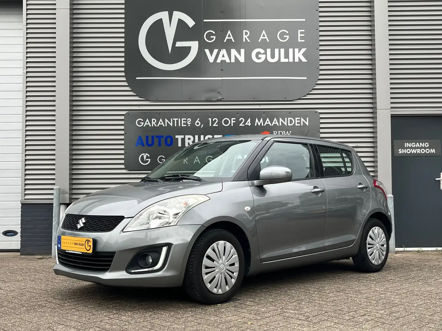 Suzuki Swift 1.2 94PK 5 deuren Airco,CruiseControl,LedVerlichti Grijs - 1