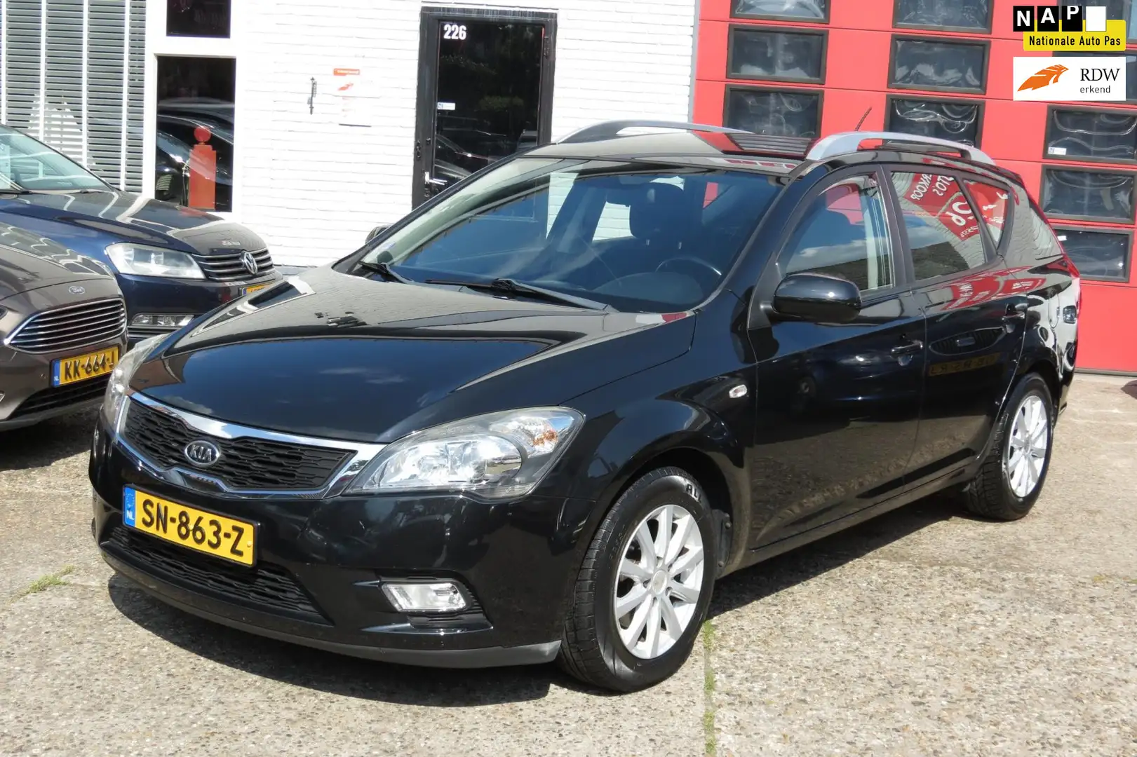 Kia Ceed / cee'd Sporty Wagon 1.4 CVVT X-ecutive , AIRCO, NAVIGATIE Zwart - 1