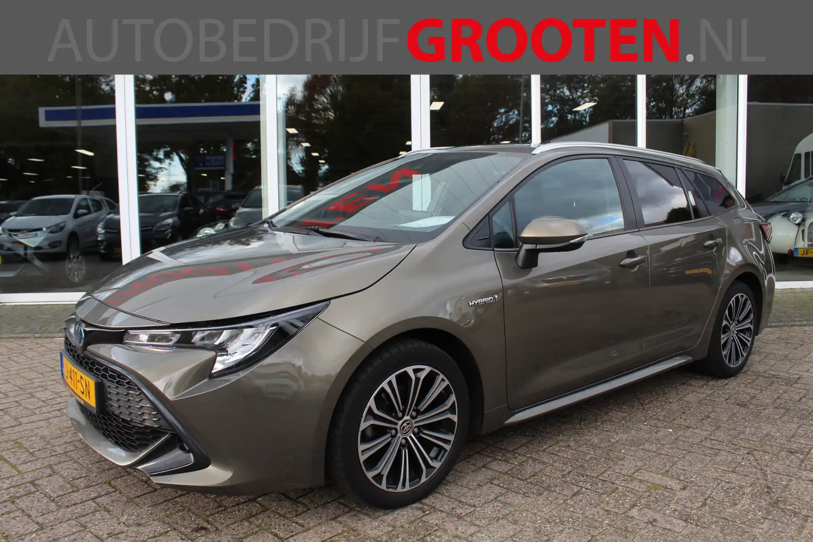 Toyota Corolla Touring Sports 1.8 Hybrid Dynamic Groen - 1