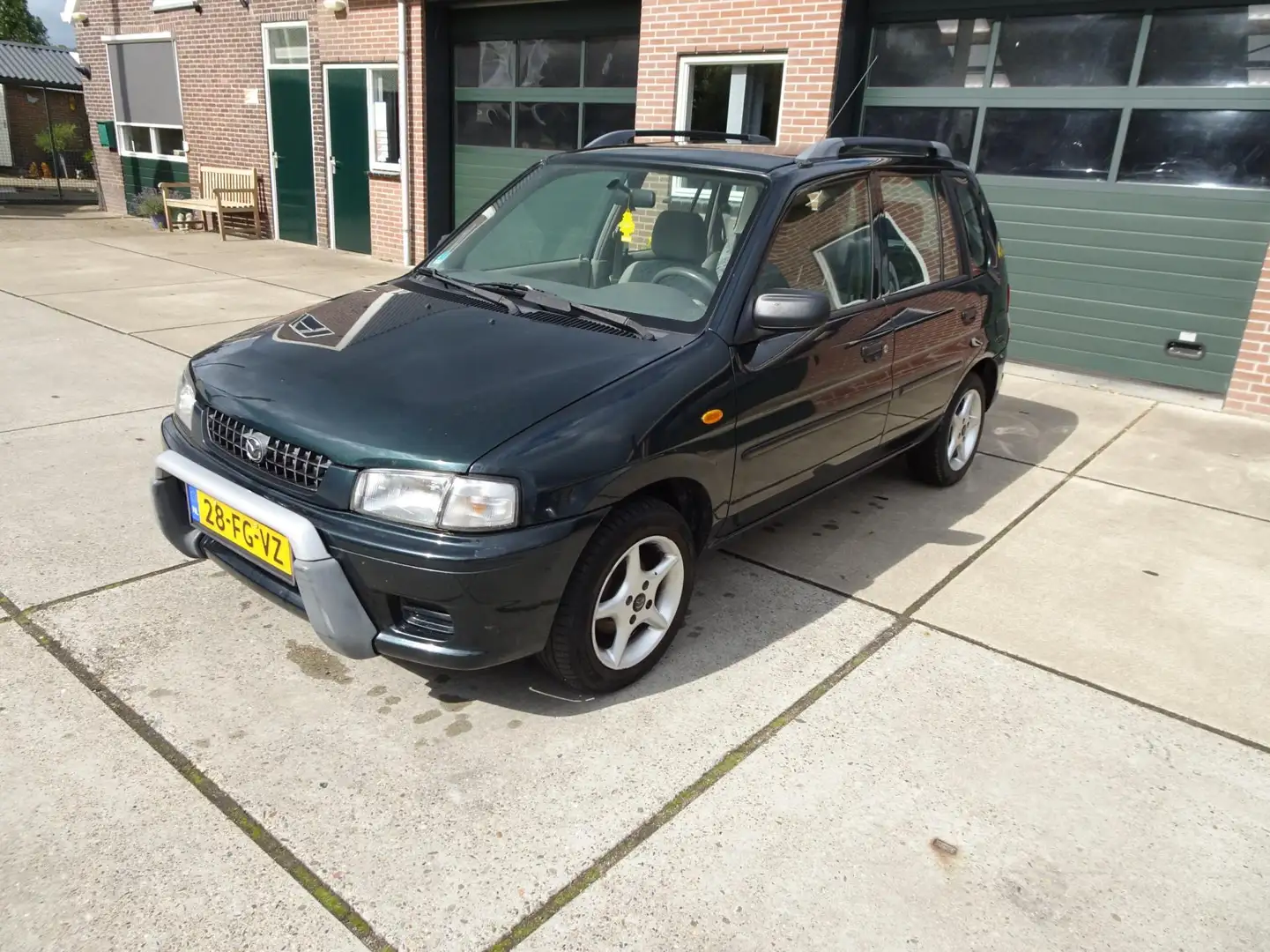 Mazda Demio 1.3 GLX Зелений - 1