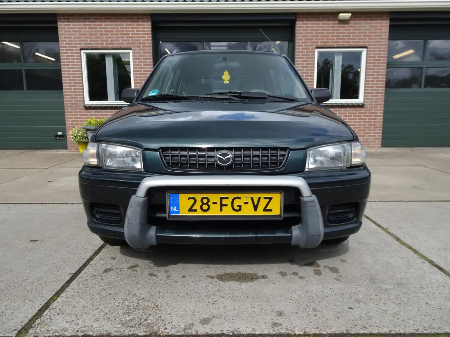 Mazda Demio 1.3 GLX Зелений - 2