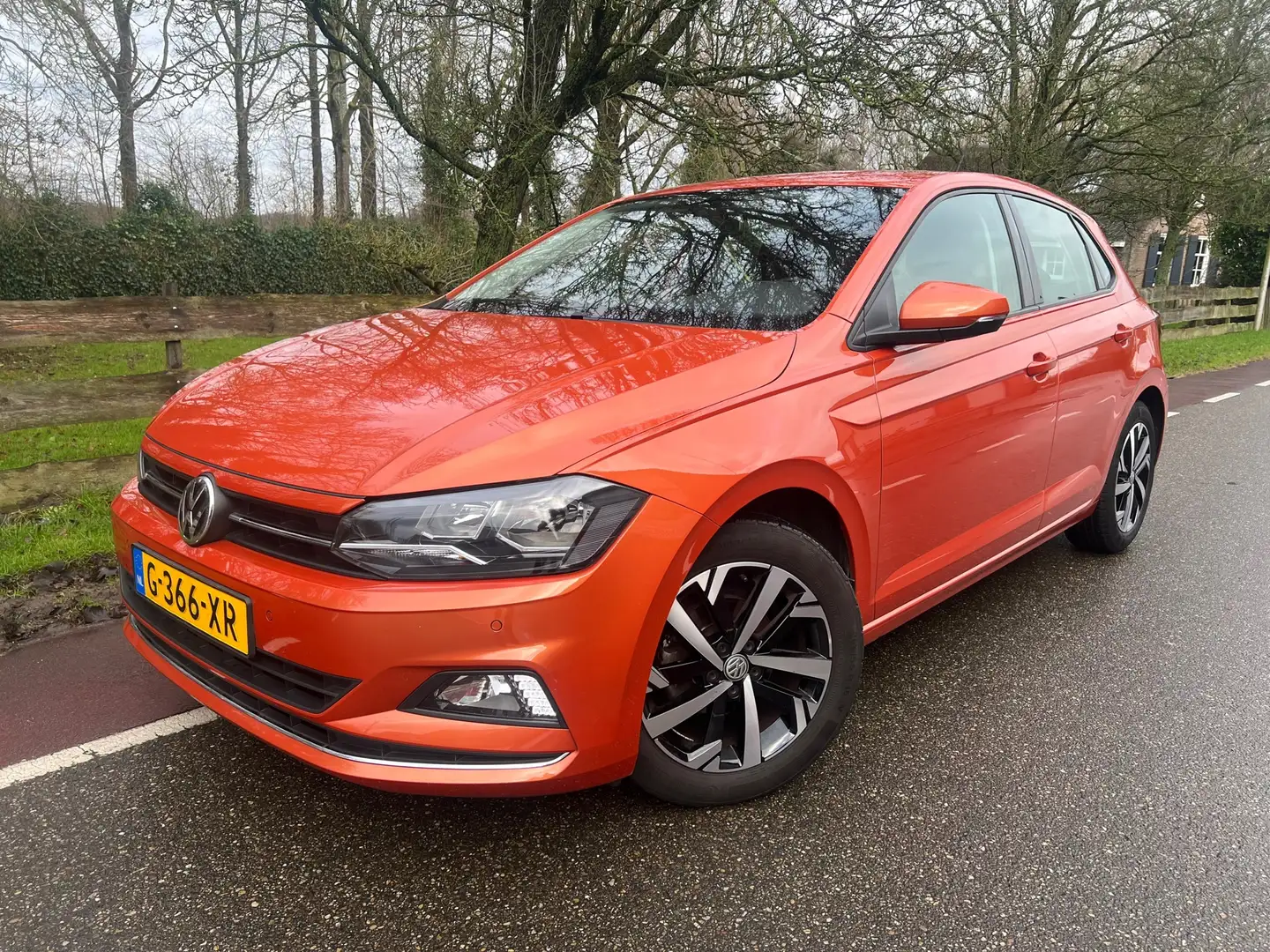 Volkswagen Polo 1.0 TSI Automaat Highline PDC Navi Orange - 1
