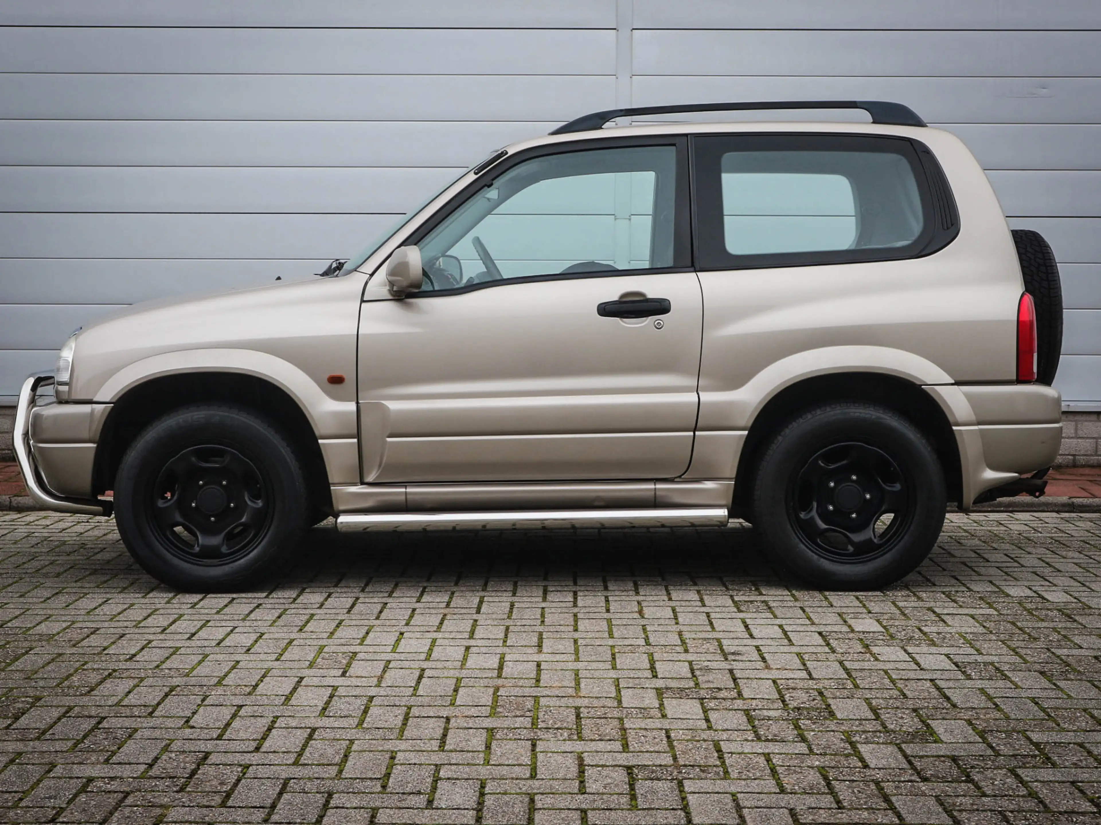 Suzuki Grand Vitara 1.6 Metal Top Wide Body | Audio | Elektrische rame — photo 9