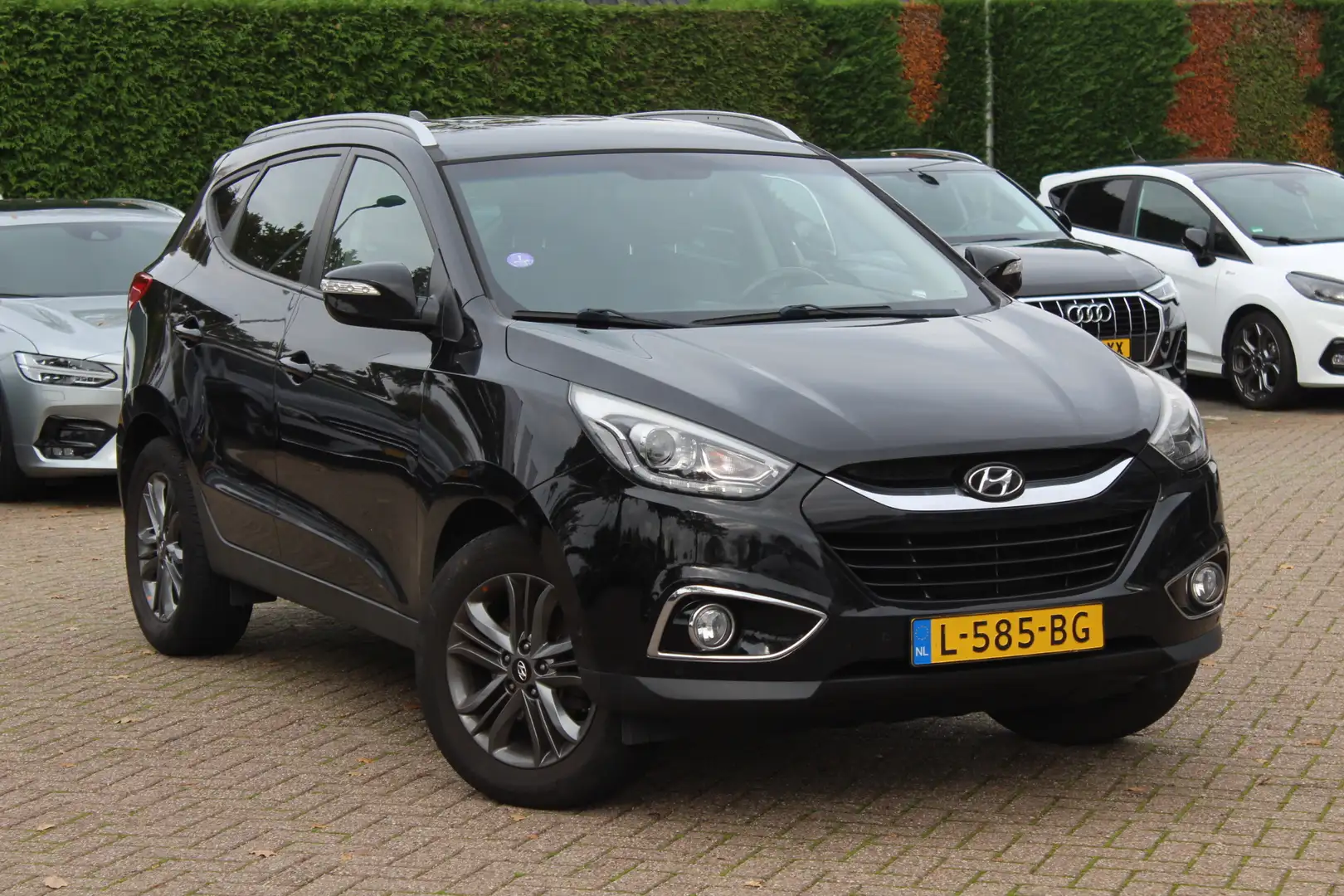 Hyundai iX35 1.6i GDI i-Catcher / Camera / Leder / Navigatie / Noir - 1