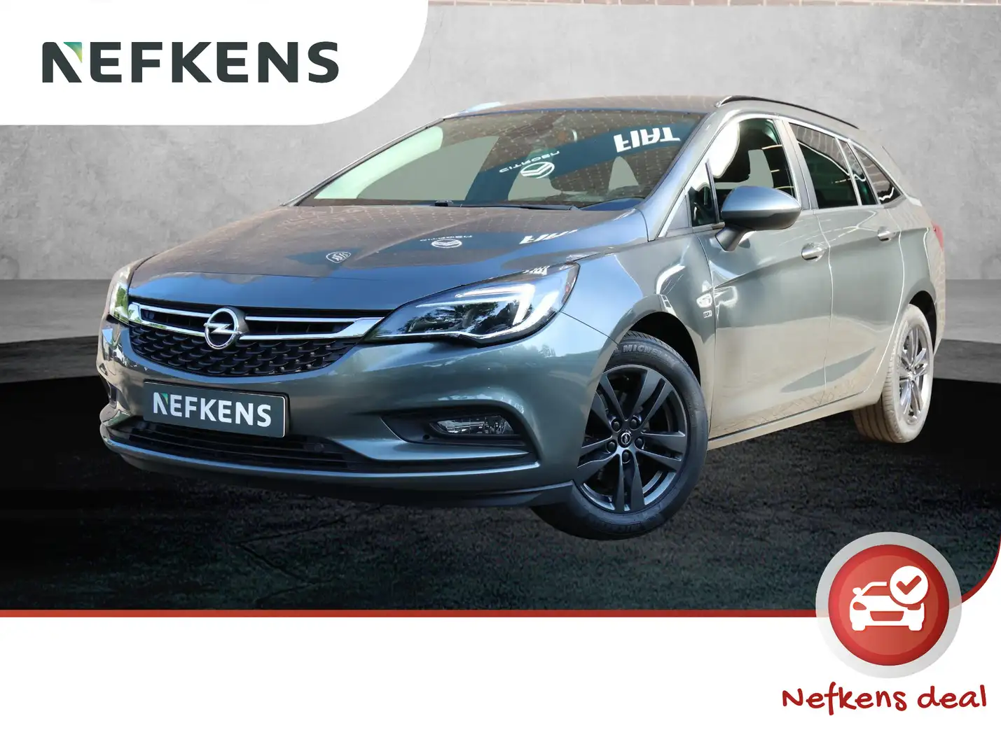Opel Astra ST 120 Jaar Edition 105pk | Navigatie | Climate Co Grau - 1