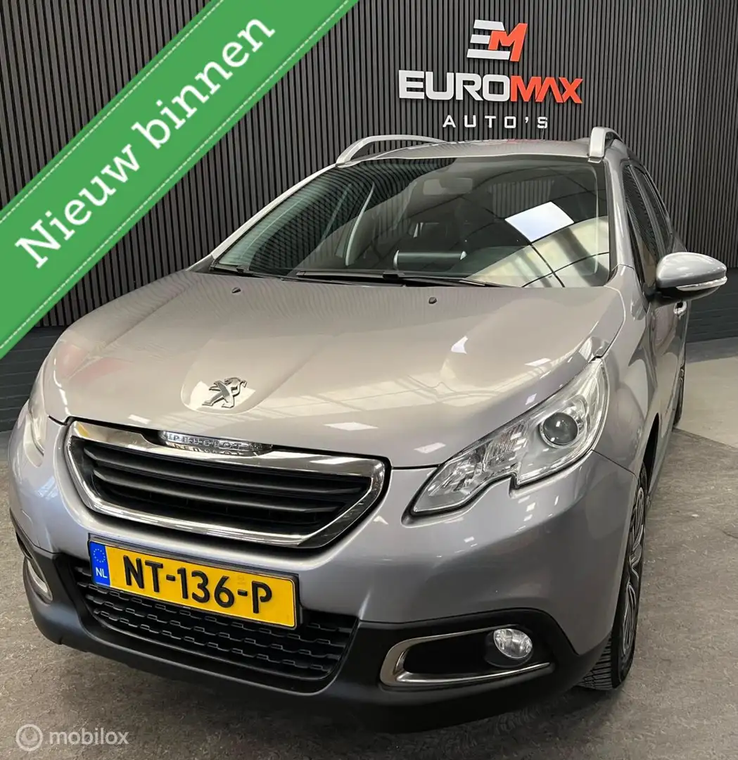 Peugeot 2008 1.2 PureTech Style NAP - 1e Eigenaar - Carplay Grijs - 1