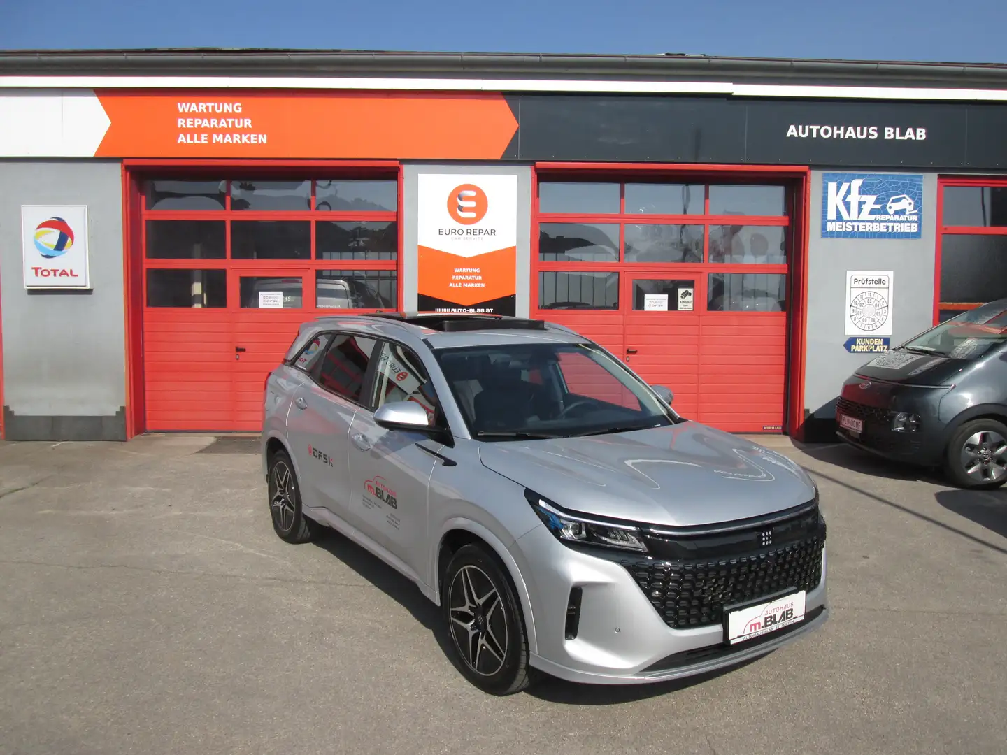 DFSK Fengon 5 E5 PHEV # Hybrid, 7 Sitzer Plateado - 1