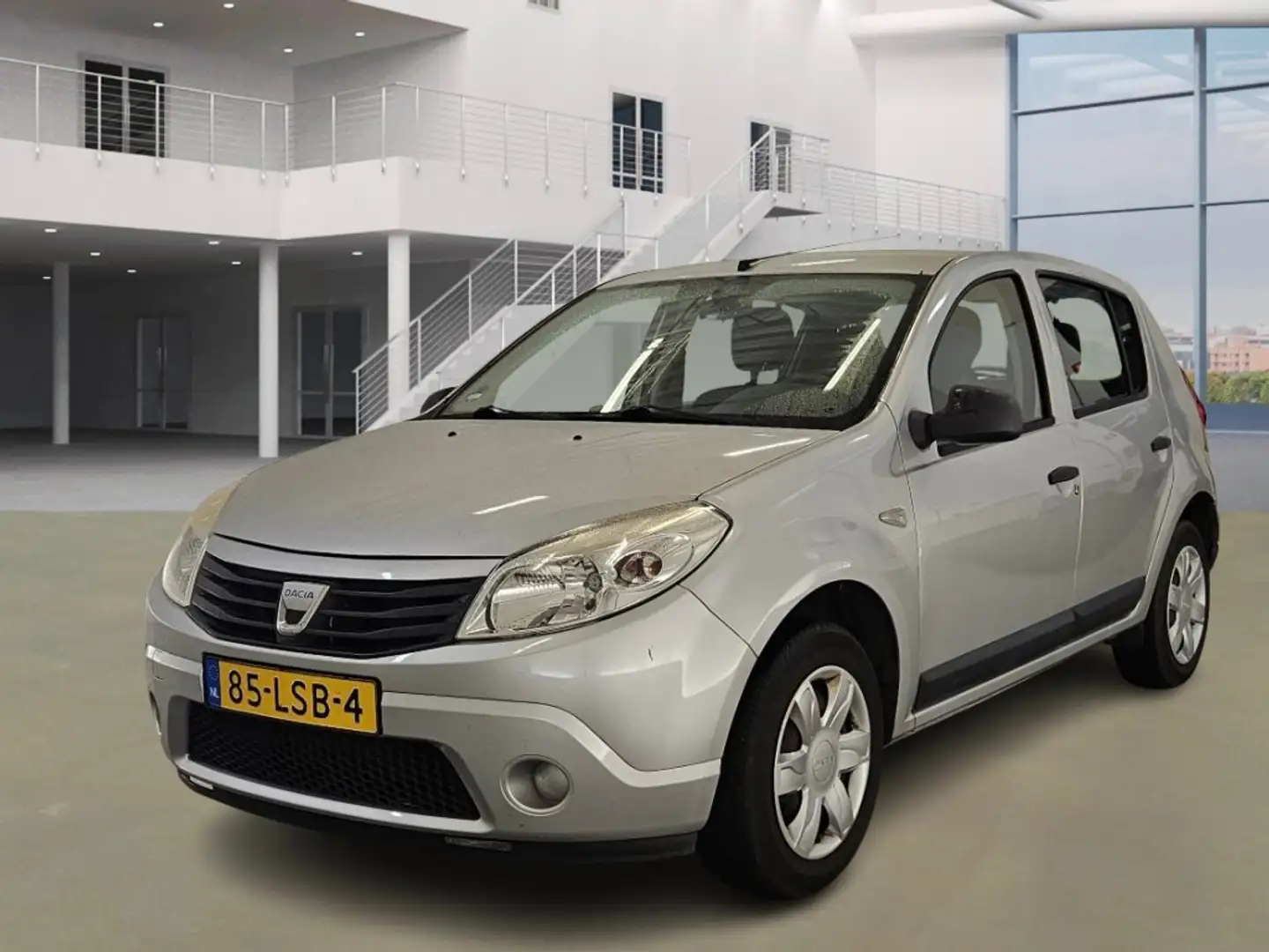 Dacia Sandero 1.2 Ambiance/ LAAG KM Gris - 1