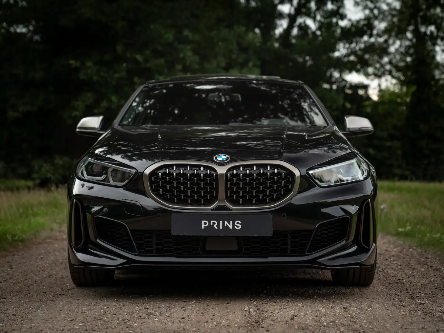 BMW 135 1-serie M135i xDrive High Executive | Pano-dak | H Zwart - 2