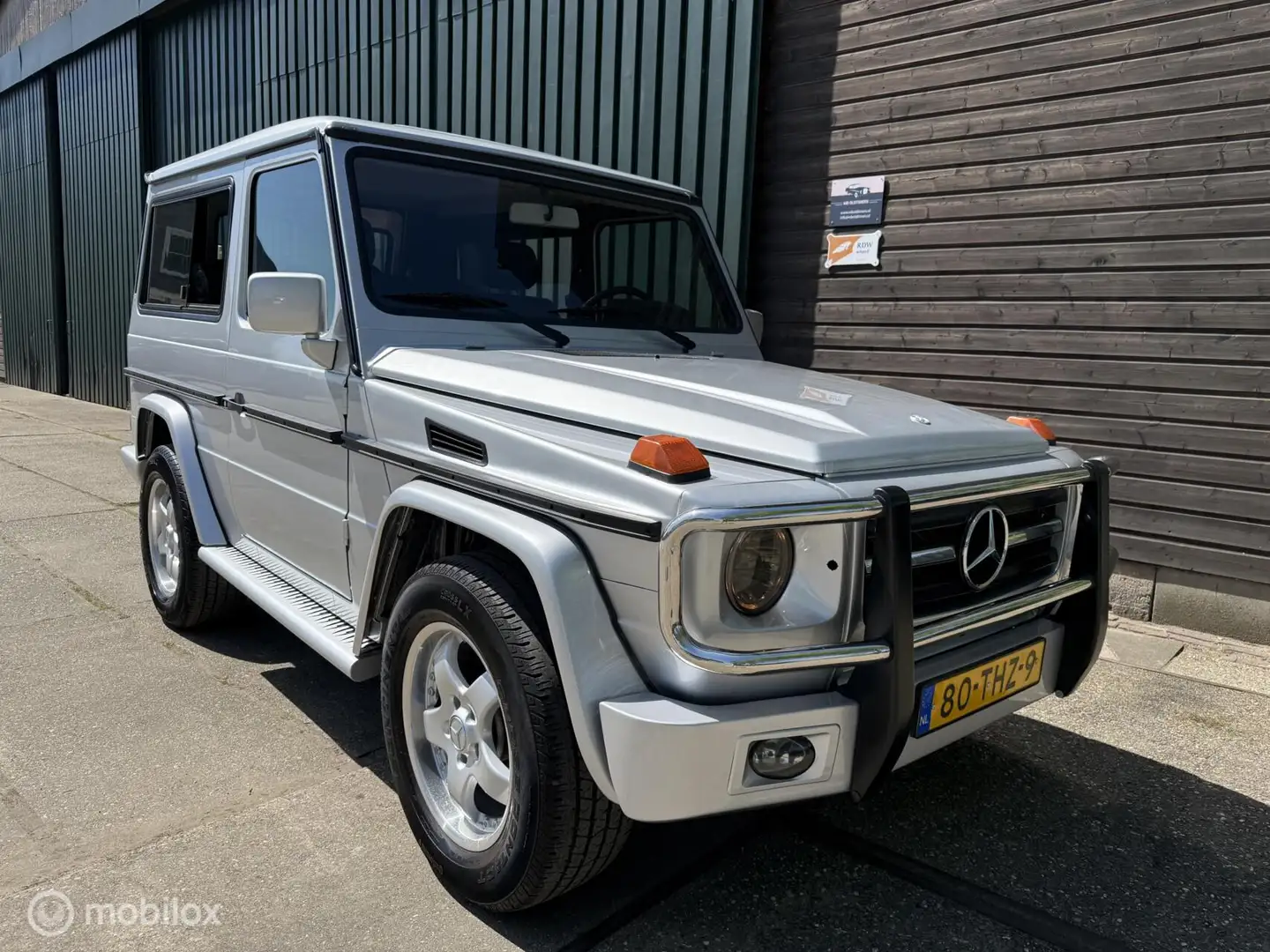 Mercedes-Benz G 230 GE 5-Bak Navi/sch.dak/el.stoel Grijs - 1