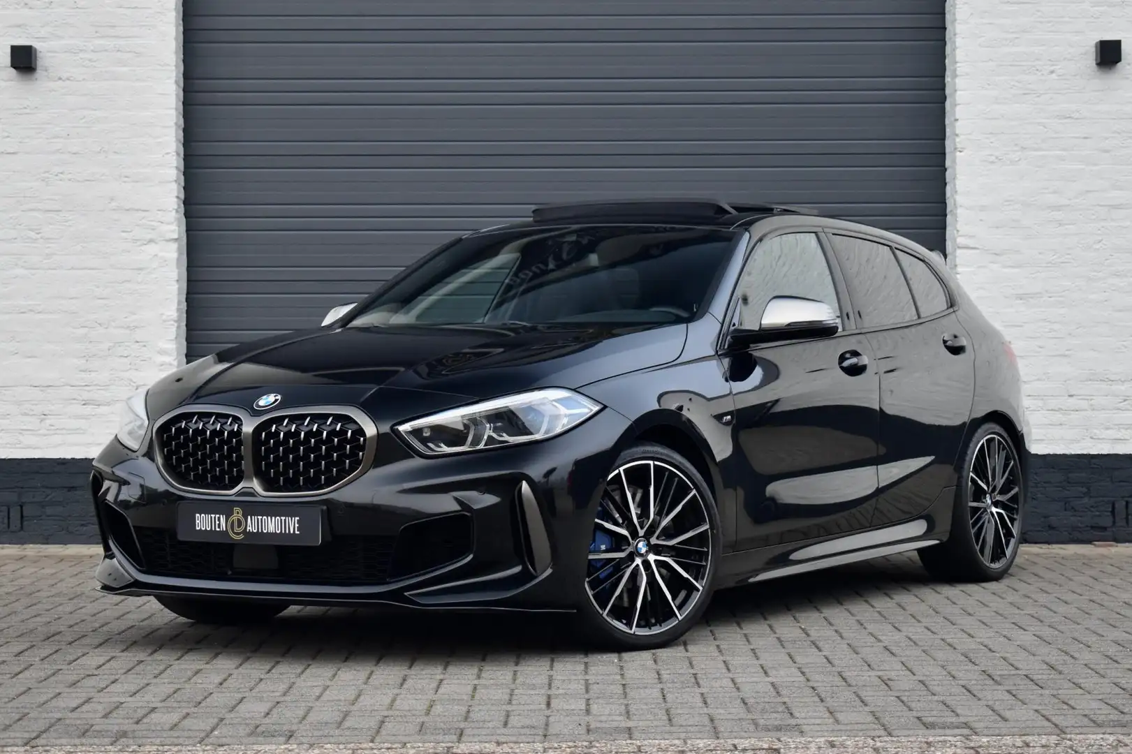 BMW 135 1-serie M135i xDrive High Executive | Pano | M-Sto Zwart - 1