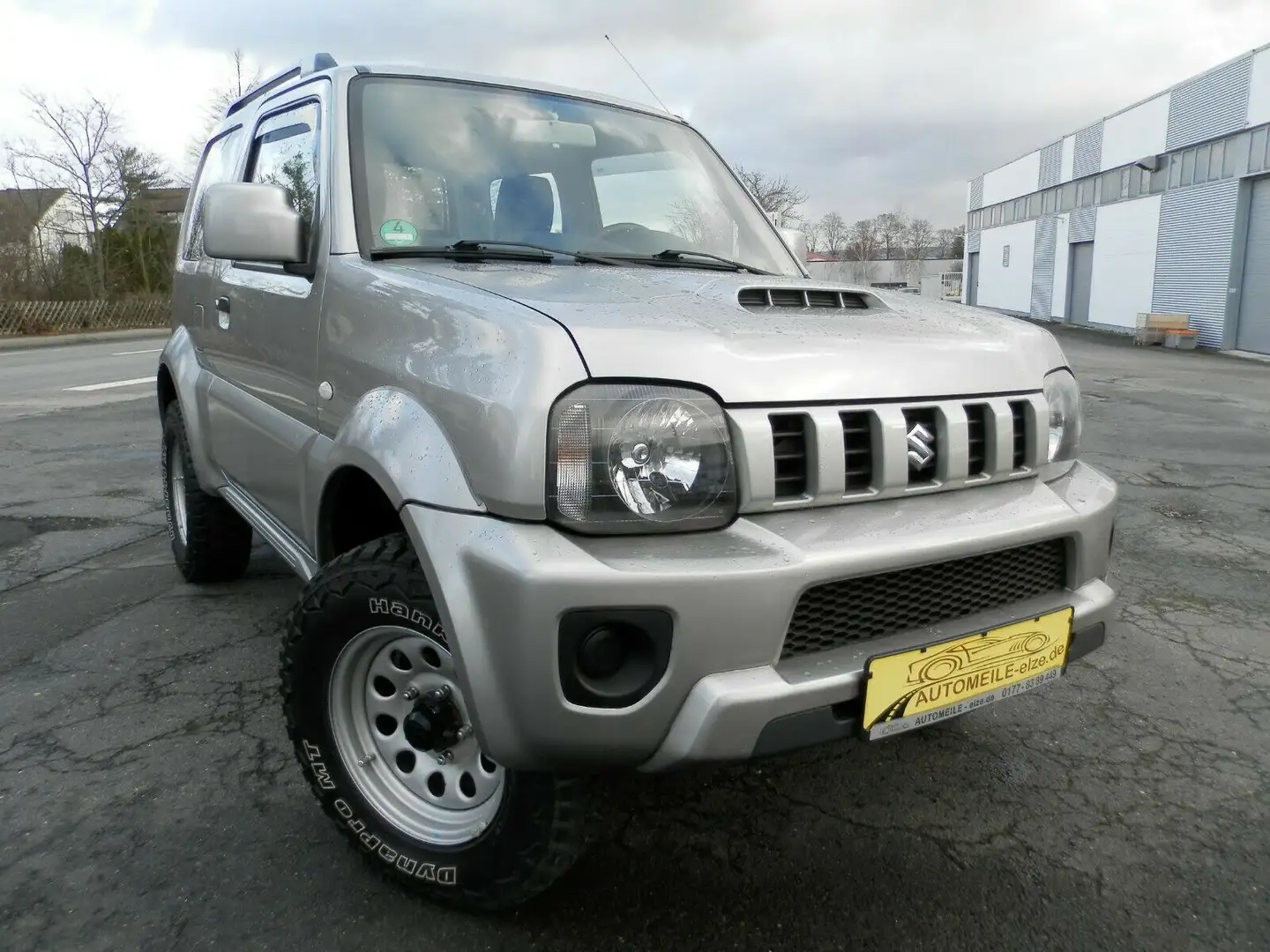 Suzuki Jimny 1.3 ALLGRIP Style*NR.88*NAVI*erst 59000KM* Grau - 1