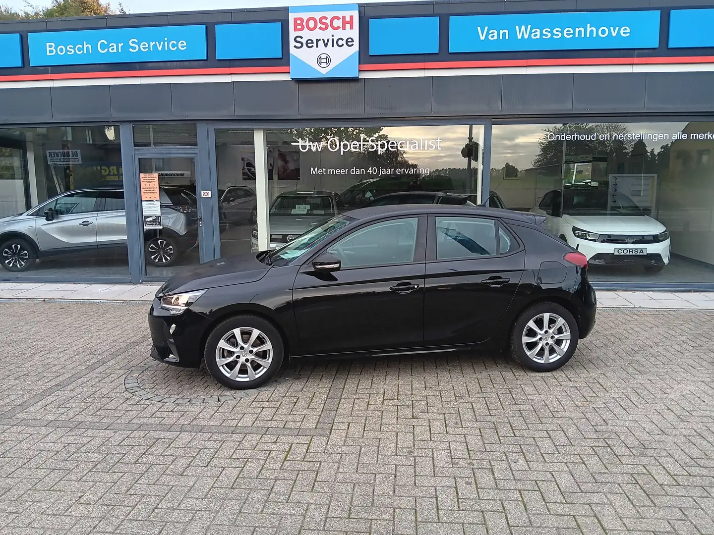 Opel Corsa Corsa 1.2 Edition 100 pk NAV DAB **OVERNAME** Zwart - 1